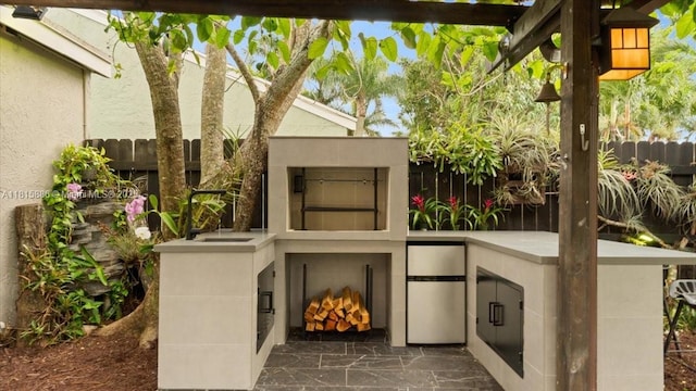 18701 Shauna Manor Dr, Boca Raton, FL 33496 - view of patio featuring a fireplace