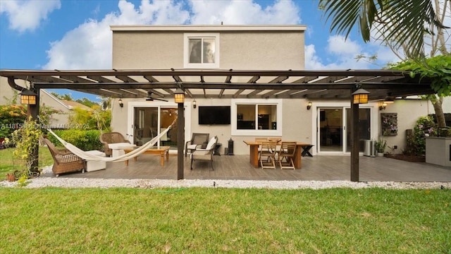 18701 Shauna Manor Dr, Boca Raton, FL 33496 - back of property featuring stucco siding, a pergola, and a lawn