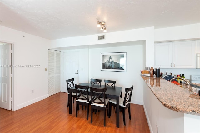 1155 Brickell Bay Dr Unit 3403, Miami, FL 33131 - dining space with light wood finished floors and baseboards