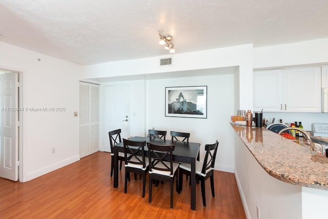 1155 Brickell Bay Dr Unit 3403, Miami, FL 33131 - dining space featuring light wood-style flooring