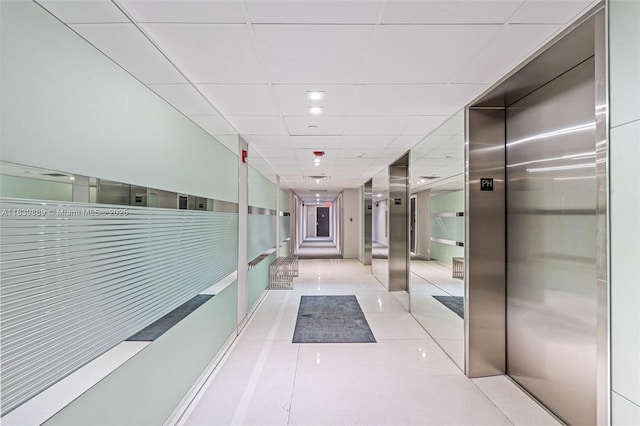 20379 W Country Club Dr Unit Ph38, Aventura, FL 33180 - corridor featuring elevator, a drop ceiling, and tile patterned flooring
