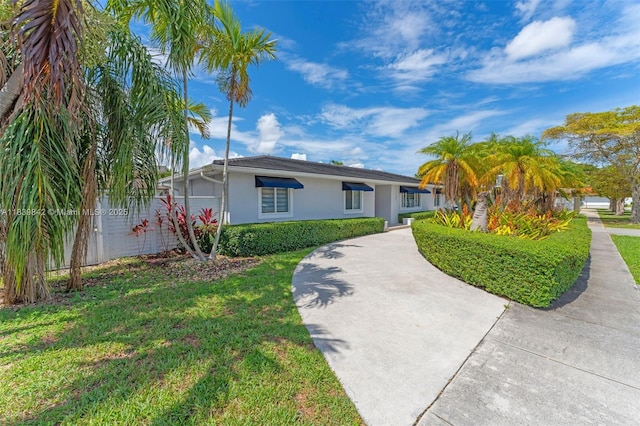 13305 SW 22nd Ter, Miami, FL 33175 - single story home with stucco siding and a front yard