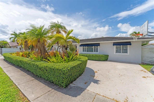 13305 SW 22nd Ter, Miami, FL 33175 - view of front of property featuring stucco siding and driveway