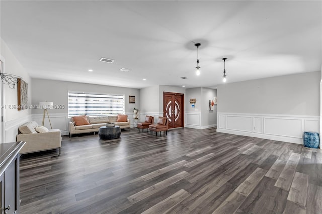 13305 SW 22nd Ter, Miami, FL 33175 - living area with dark wood-style flooring, wainscoting, a decorative wall, and recessed lighting