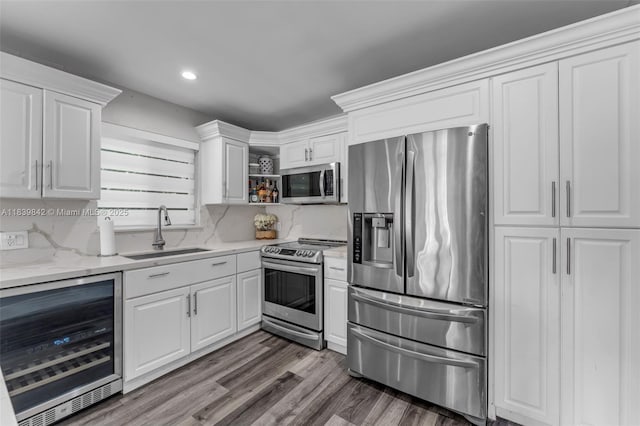13305 SW 22nd Ter, Miami, FL 33175 - kitchen featuring stainless steel appliances, wine cooler, open shelves, white cabinetry, and wood finished floors