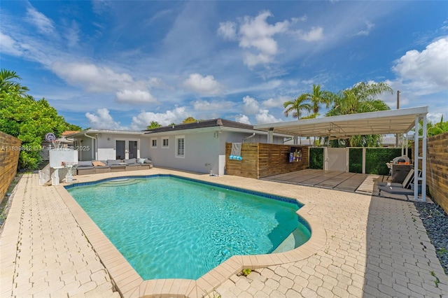 13305 SW 22nd Ter, Miami, FL 33175 - view of pool featuring french doors, a patio, and an outdoor living space