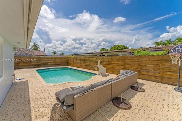 13305 SW 22nd Ter, Miami, FL 33175 - view of swimming pool with a patio, a fenced backyard, and an outdoor hangout area