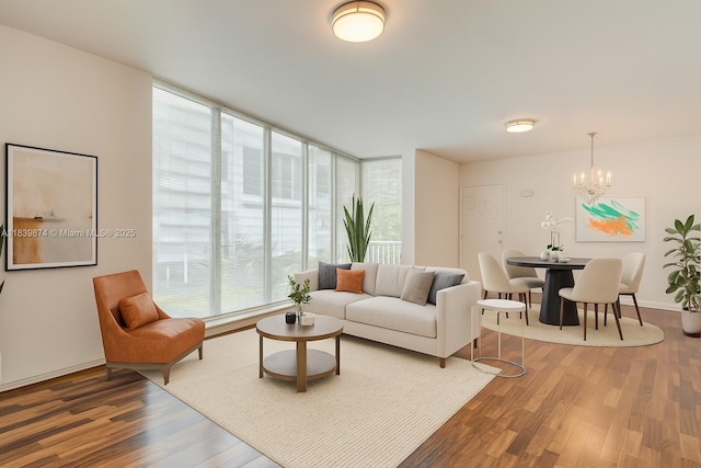 10178 Collins Ave Unit 102, Bal Harbour, FL 33154 - living area with wood finished floors and a chandelier