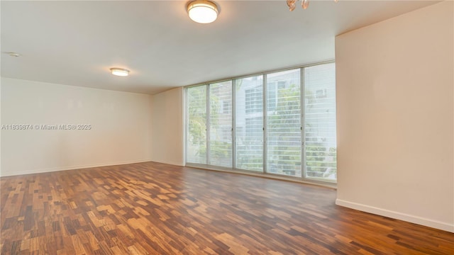 10178 Collins Ave Unit 102, Bal Harbour, FL 33154 - empty room featuring wood finished floors and expansive windows