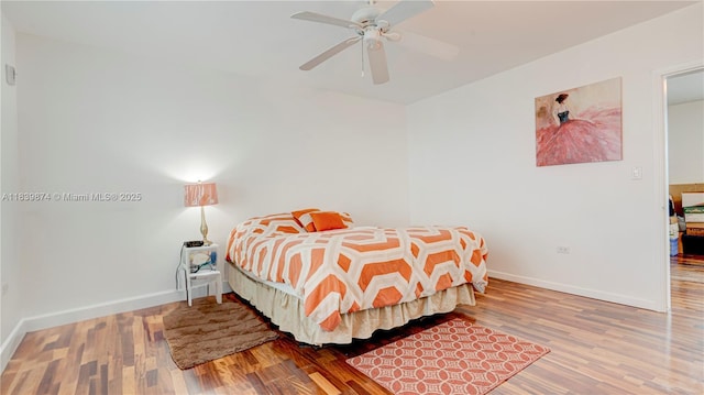 10178 Collins Ave Unit 102, Bal Harbour, FL 33154 - bedroom with wood finished floors and a ceiling fan