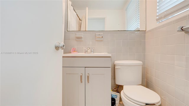 10178 Collins Ave Unit 102, Bal Harbour, FL 33154 - bathroom featuring vanity and tile walls