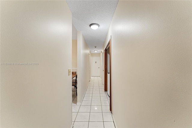 14213 SW 100th Ln, Miami, FL 33186 - hall featuring light tile patterned flooring and a textured ceiling
