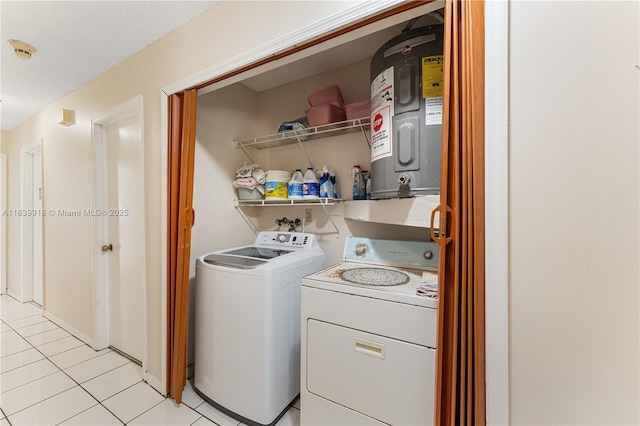 14213 SW 100th Ln, Miami, FL 33186 - laundry area featuring washing machine and dryer, water heater, and light tile patterned floors
