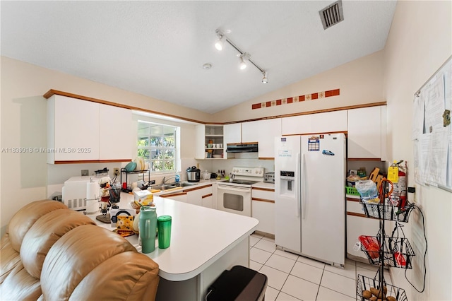 14213 SW 100th Ln, Miami, FL 33186 - kitchen with white appliances, vaulted ceiling, under cabinet range hood, a peninsula, and white cabinets
