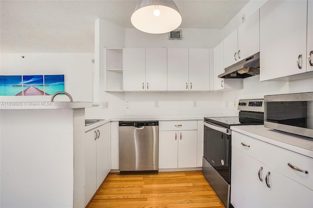 19701 E Country Club Dr Unit 5104, Aventura, FL 33180 - kitchen featuring stainless steel appliances, under cabinet range hood, open shelves, light countertops, and white cabinetry