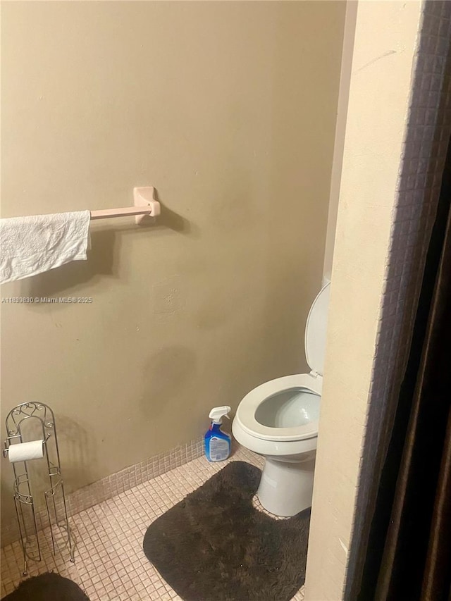 5335 NW 10th Ct Unit 208, Plantation, FL 33313 - bathroom featuring toilet and tile patterned floors
