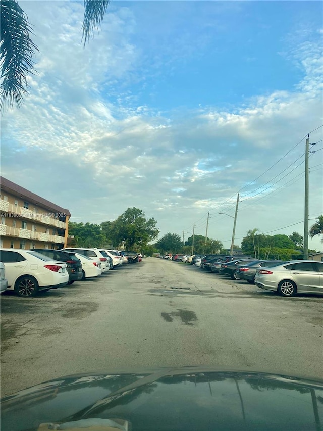 5335 NW 10th Ct Unit 208, Plantation, FL 33313 - view of asphalt road featuring street lights