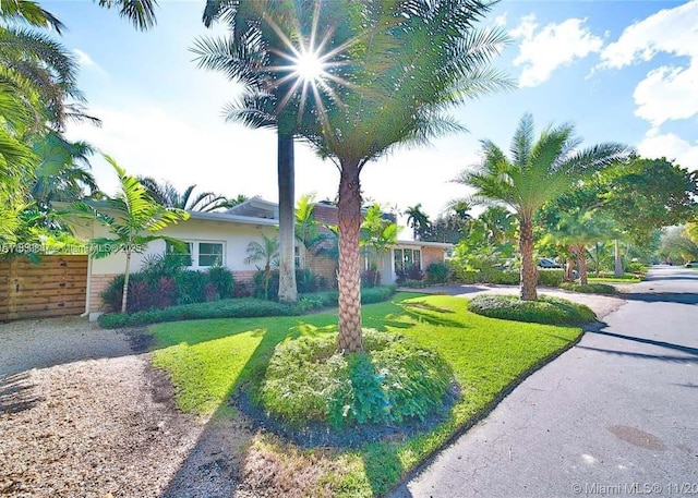 920 NE 72nd St, Miami, FL 33138 - view of front of property with a front yard and stucco siding