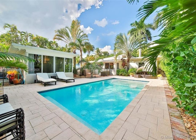 920 NE 72nd St, Miami, FL 33138 - outdoor pool with a sunroom and a patio area