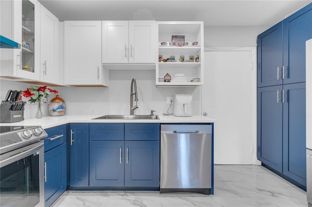 1340 NW 128th St, North Miami, FL 33167 - kitchen with appliances with stainless steel finishes, light marble finish floors, blue cabinetry, and light countertops