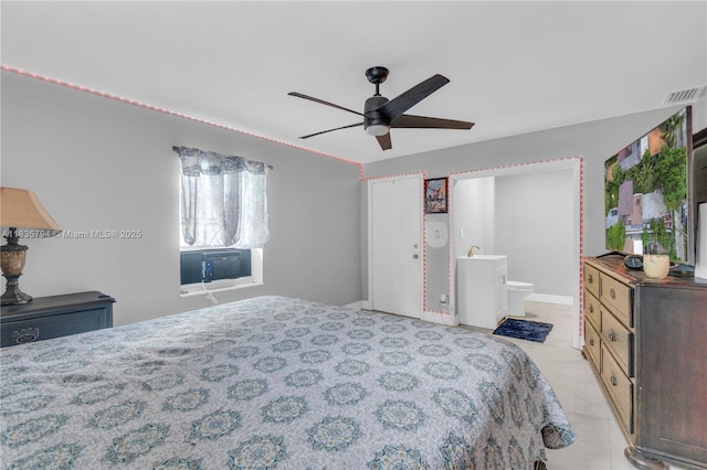 1340 NW 128th St, North Miami, FL 33167 - bedroom with light tile patterned flooring, cooling unit, ensuite bathroom, and ceiling fan