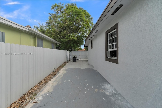 1340 NW 128th St, North Miami, FL 33167 - view of property exterior with stucco siding and a patio