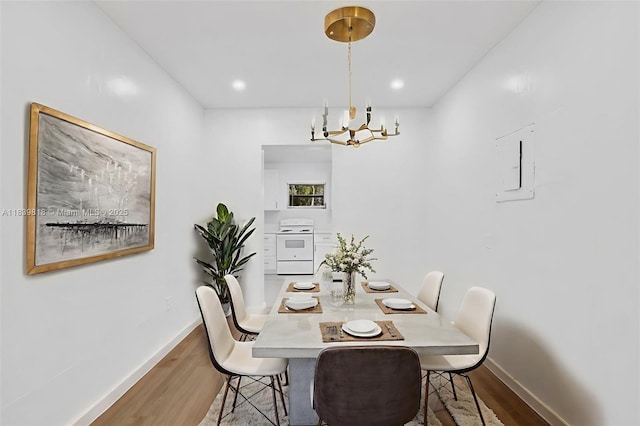 1315 NE 146th St, Miami, FL 33161 - dining space featuring wood finished floors, a chandelier, and electric panel