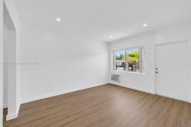 1315 NE 146th St, Miami, FL 33161 - spare room with wood finished floors, recessed lighting, and a wall mounted air conditioner