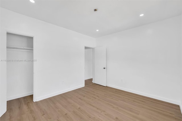 1315 NE 146th St, Miami, FL 33161 - unfurnished bedroom with light wood-style floors, recessed lighting, and a closet