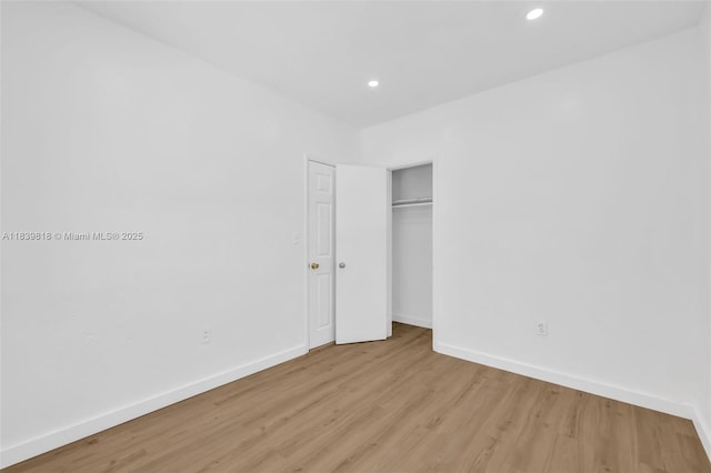 1315 NE 146th St, Miami, FL 33161 - unfurnished bedroom with light wood-style floors, recessed lighting, and a closet