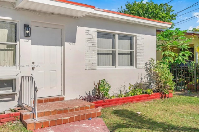 1315 NE 146th St, Miami, FL 33161 - entrance to property with stucco siding and a yard