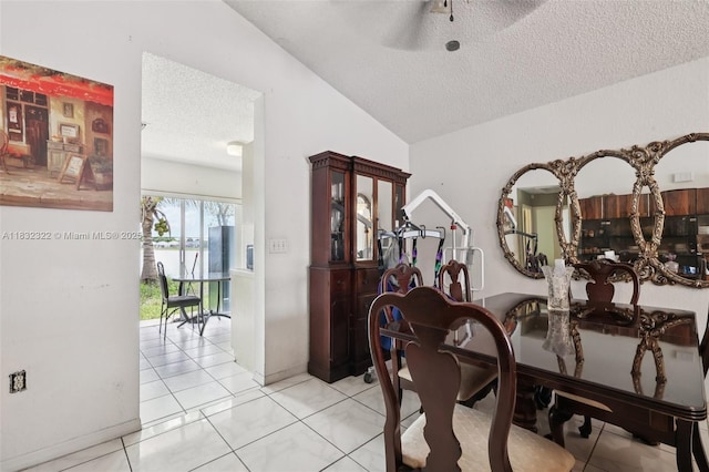 3120 NW 203rd Ter, Miami Gardens, FL 33056 - dining space featuring a textured ceiling, lofted ceiling, light tile patterned floors, and ceiling fan