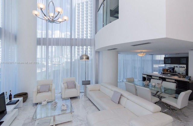 200 Biscayne Boulevard Way Unit 502, Miami, FL 33131 - living area with marble tiled floors, a chandelier, and a towering ceiling