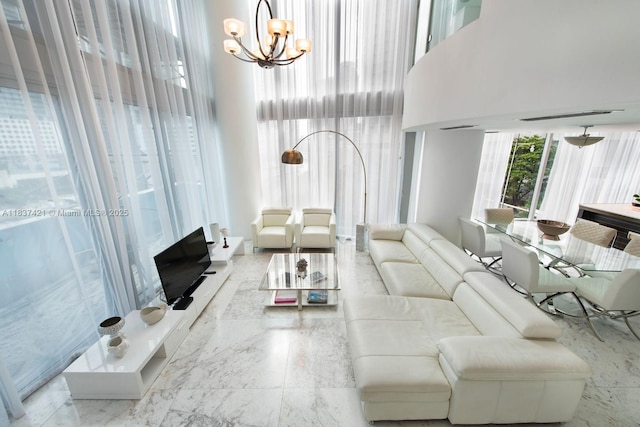 200 Biscayne Boulevard Way Unit 502, Miami, FL 33131 - living room with a high ceiling, a chandelier, a fireplace, and marble finish flooring