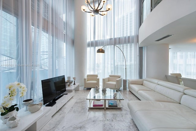 200 Biscayne Boulevard Way Unit 502, Miami, FL 33131 - living room featuring a towering ceiling and a chandelier