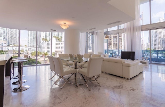 200 Biscayne Boulevard Way Unit 502, Miami, FL 33131 - dining space featuring expansive windows