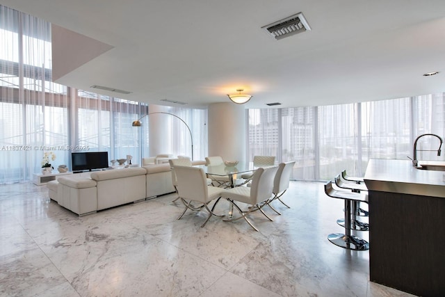 200 Biscayne Boulevard Way Unit 502, Miami, FL 33131 - dining room with floor to ceiling windows