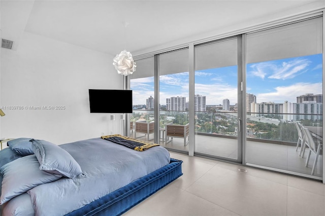 18975 Collins Ave Unit 1105, Sunny Isles Beach, FL 33160 - bedroom with multiple windows, access to exterior, and a wall of windows