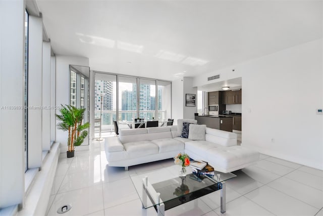 485 Brickell Ave Unit 2908, Miami, FL 33131 - living room featuring light tile patterned floors and a wall of windows