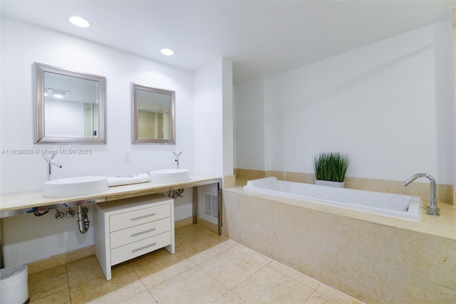 485 Brickell Ave Unit 2908, Miami, FL 33131 - full bath with a garden tub, tile patterned flooring, and double vanity