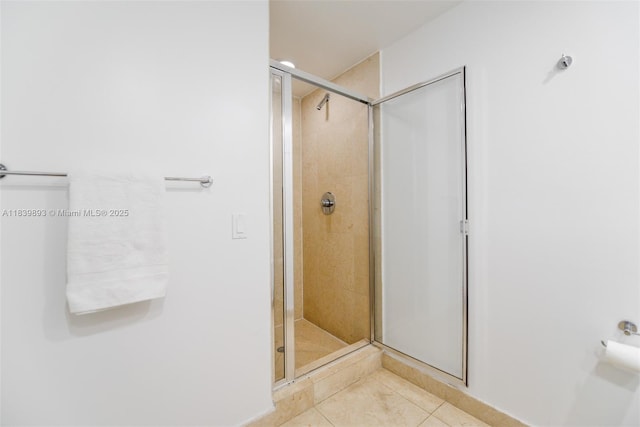 485 Brickell Ave Unit 2908, Miami, FL 33131 - bathroom with a stall shower and tile patterned flooring