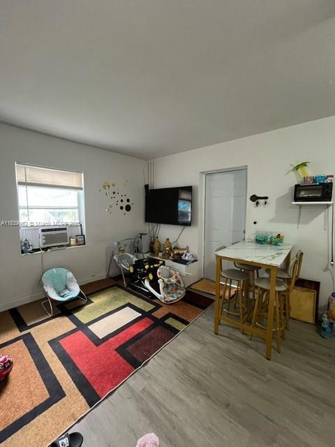 7230 NW 3rd St, Miami, FL 33126 - living room featuring cooling unit and wood finished floors
