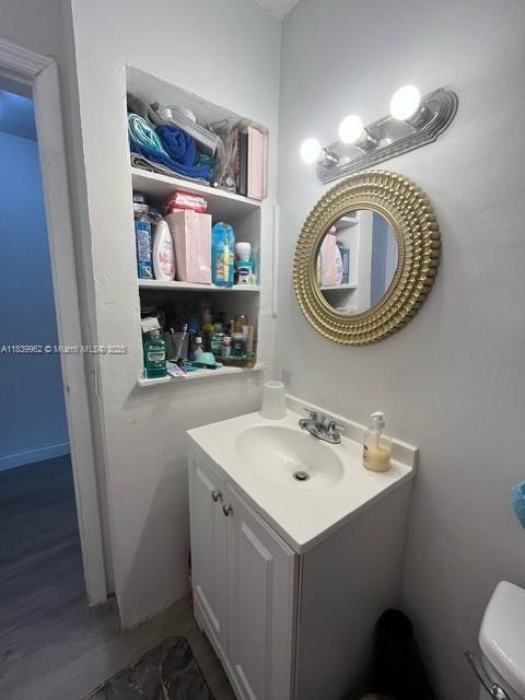 7230 NW 3rd St, Miami, FL 33126 - half bathroom with vanity and wood finished floors
