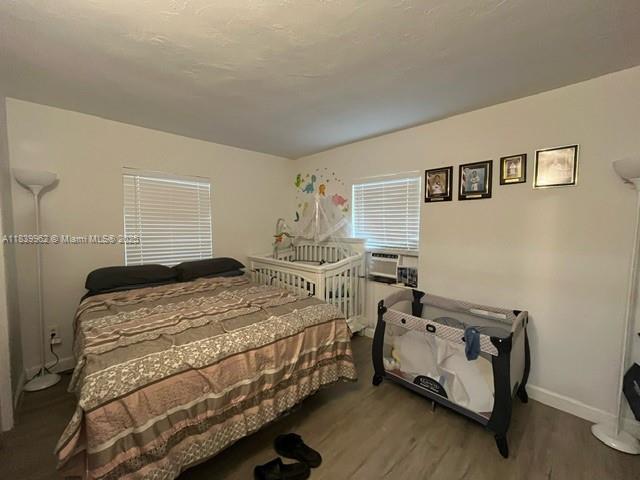 7230 NW 3rd St, Miami, FL 33126 - bedroom with wood finished floors and cooling unit