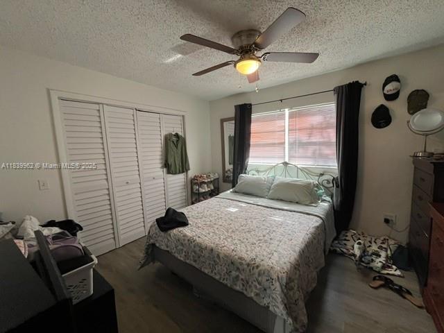 7230 NW 3rd St, Miami, FL 33126 - bedroom with wood finished floors, a textured ceiling, a closet, and a ceiling fan