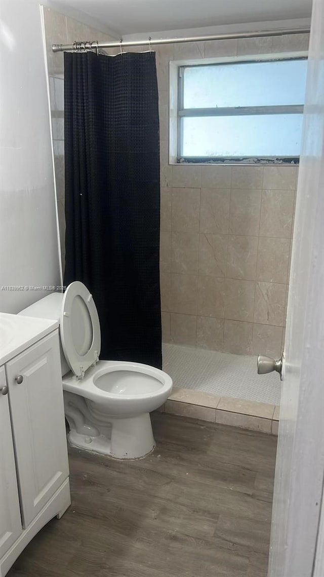 7230 NW 3rd St, Miami, FL 33126 - bathroom with a stall shower, wood finished floors, and vanity