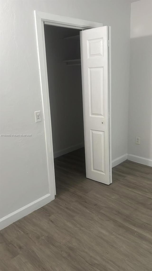 7230 NW 3rd St, Miami, FL 33126 - unfurnished bedroom featuring dark wood finished floors and a closet