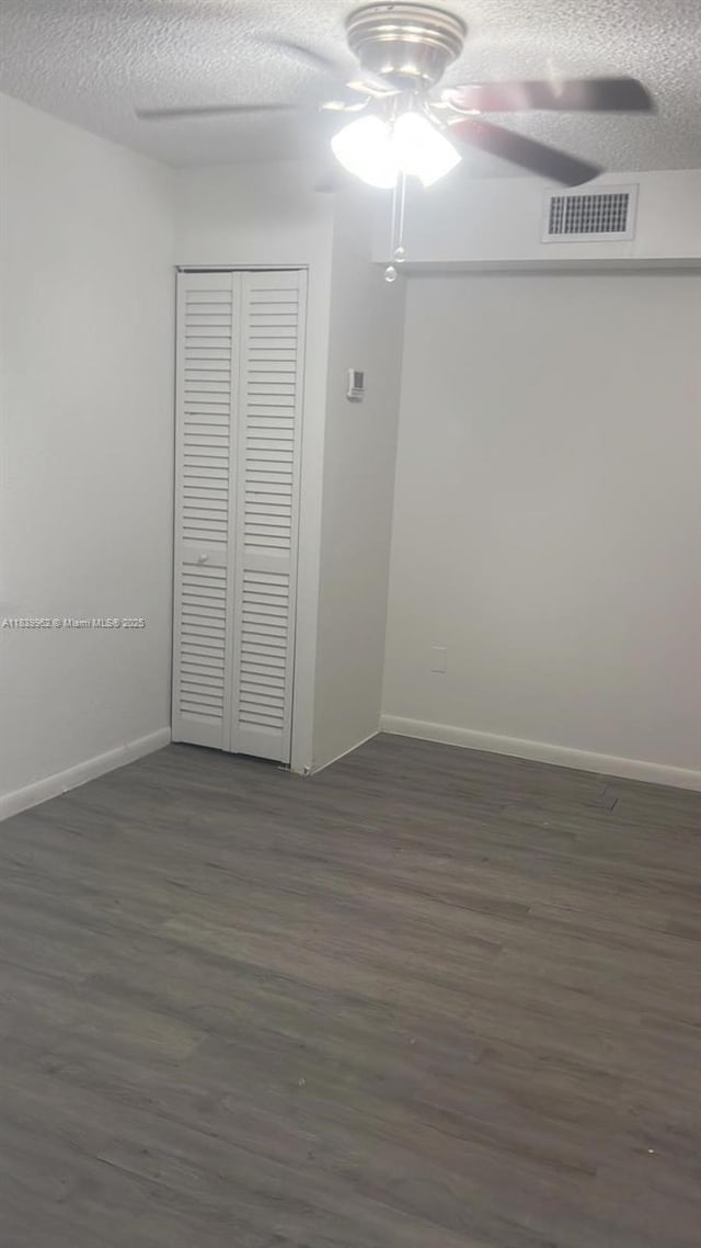 7230 NW 3rd St, Miami, FL 33126 - spare room featuring a ceiling fan, dark wood finished floors, and a textured ceiling