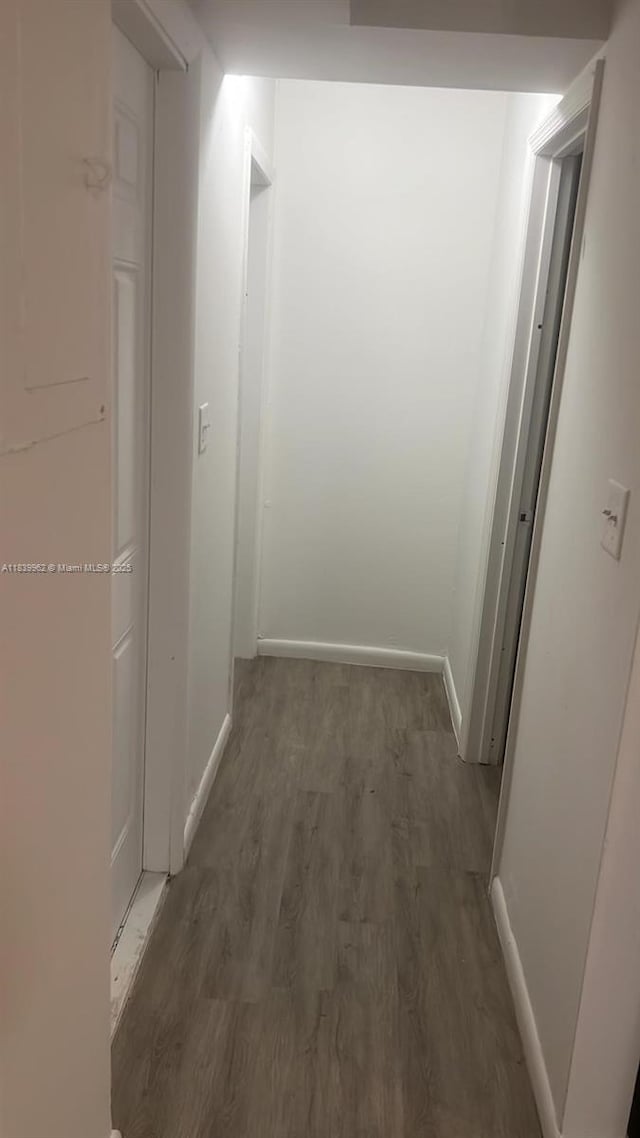 7230 NW 3rd St, Miami, FL 33126 - hall featuring baseboards and wood finished floors