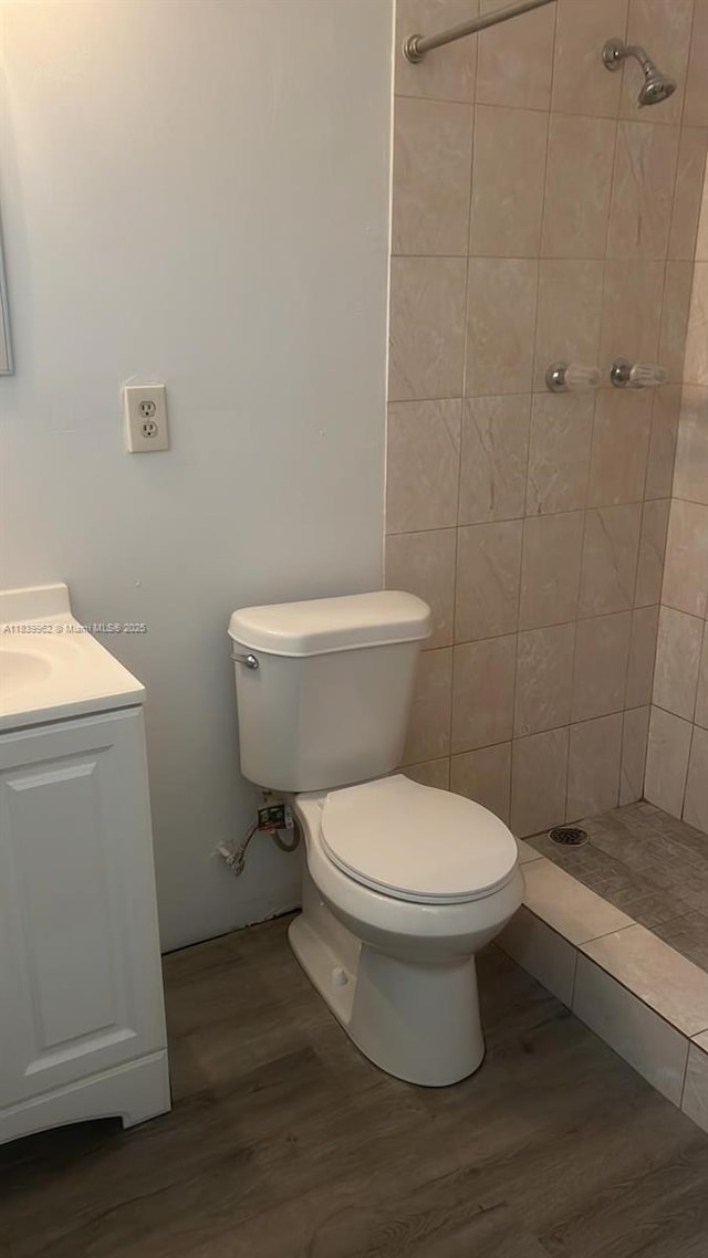 7230 NW 3rd St, Miami, FL 33126 - full bathroom featuring tiled shower, wood finished floors, and vanity